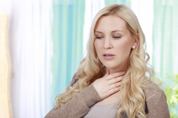 woman has a sore throat