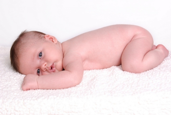 A portrait of a naked newborn baby