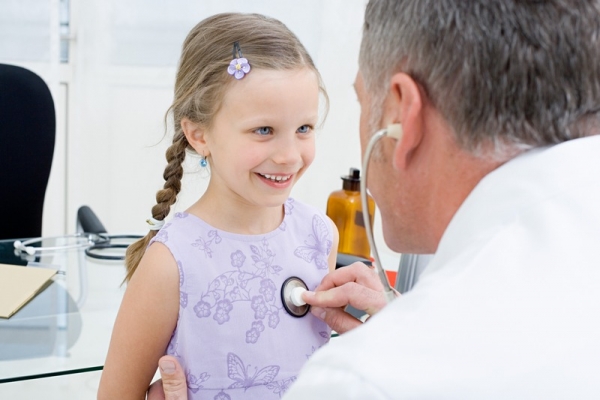 Girl being checked by a doctor